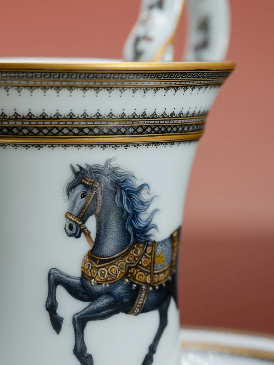 Horse motif on a porcelain vessel against a rose background