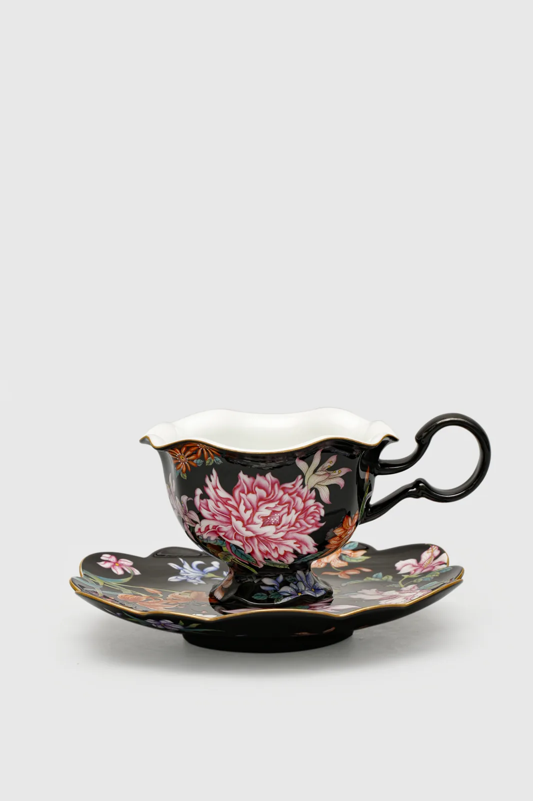 Front view of the Nocturnal Bloom porcelain cup and saucer